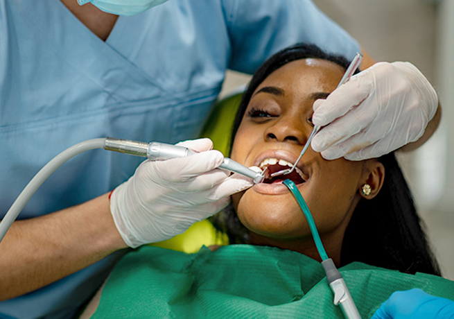 Dentist performing a surgery on the patient