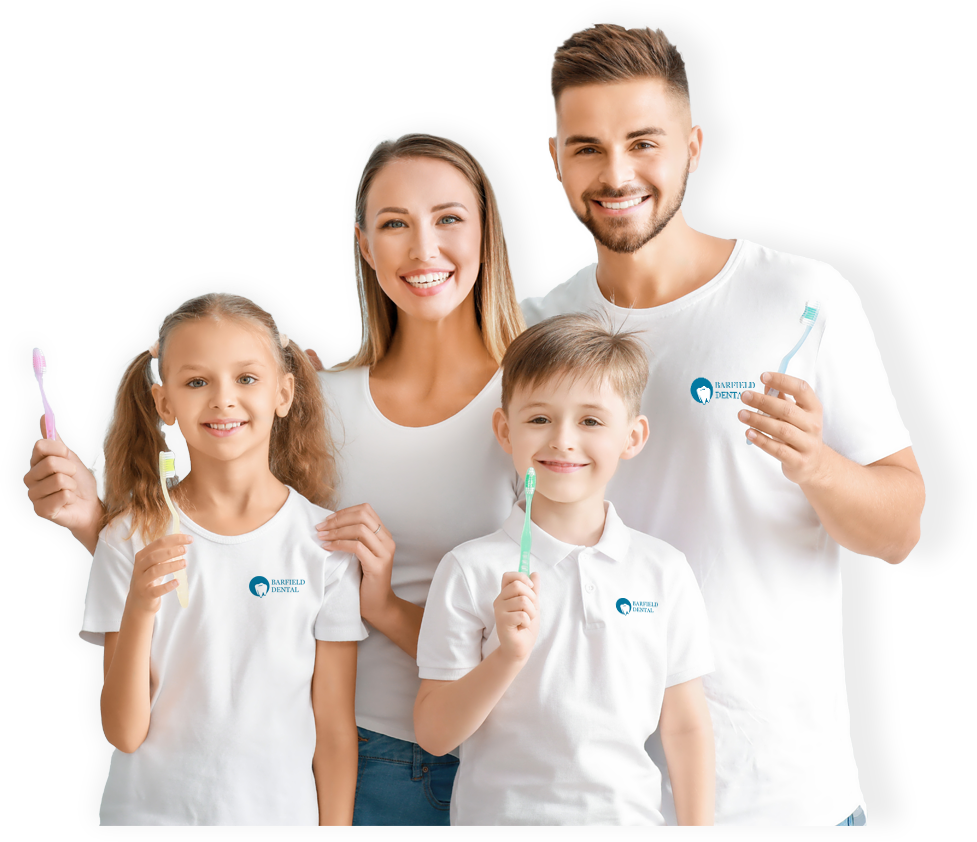 Smiling Family, Family holding toothbrushes, Family wearing white tshirts with Barfield Dental Logo
