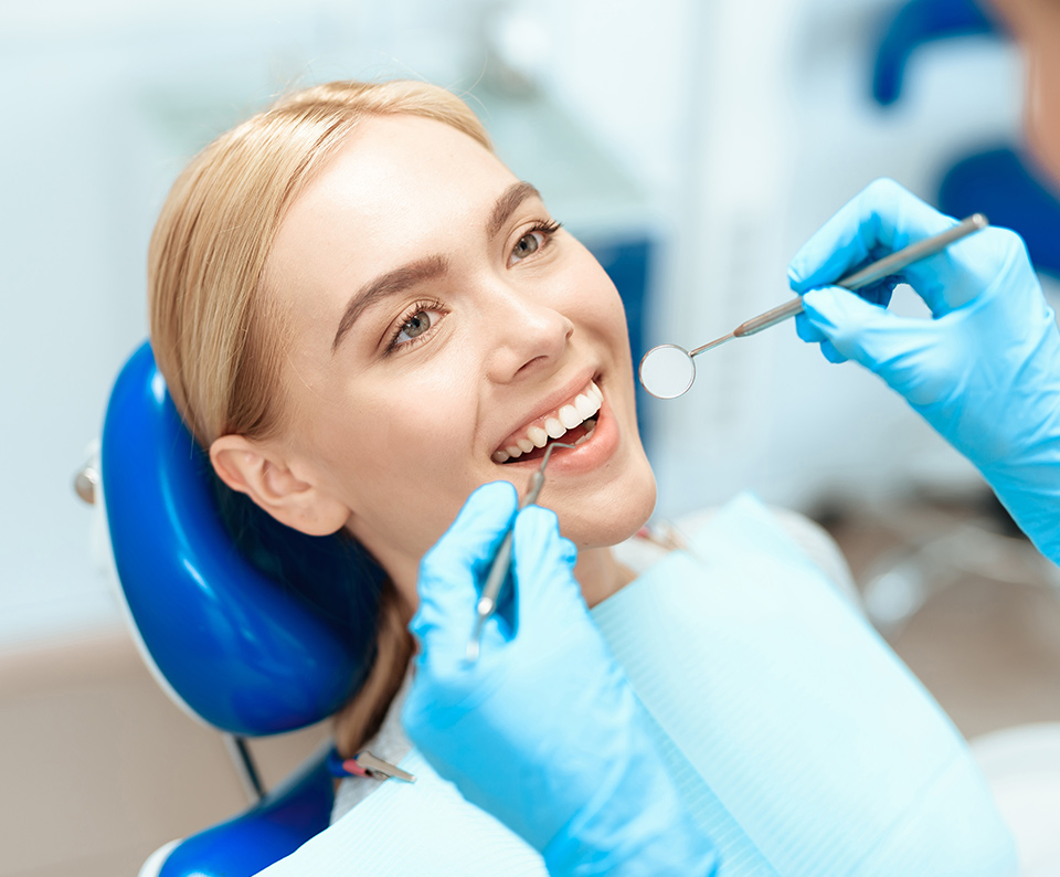 Woman preparing to open mouth for a teeth checkup